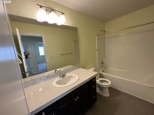 full bath featuring toilet, vanity, shower / tub combination, and a textured ceiling
