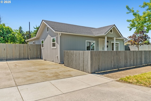 1121 D St, Springfield, OR 97477 - view of side of home with driveway and a shingled roof