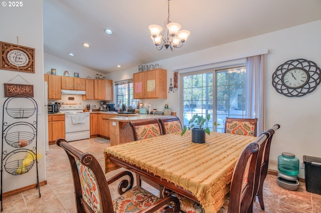 dining room with an inviting chandelier and lofted ceiling