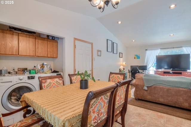 dining room with a notable chandelier, washer / dryer, and lofted ceiling