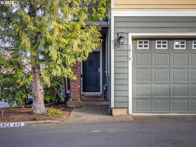 entrance to property featuring a garage