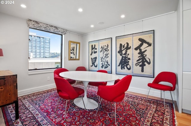 dining area with recessed lighting, baseboards, and wood finished floors