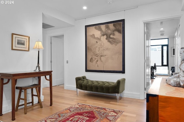 interior space with recessed lighting, light wood finished floors, and baseboards
