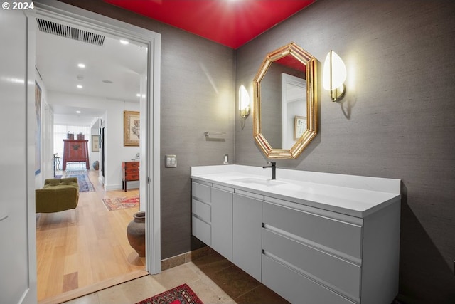 bathroom with vanity, recessed lighting, and visible vents