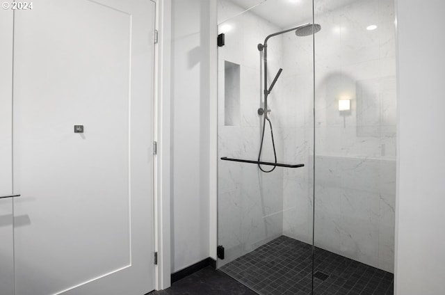 full bathroom with a marble finish shower