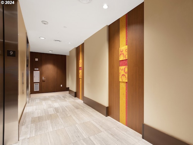 corridor featuring recessed lighting and visible vents