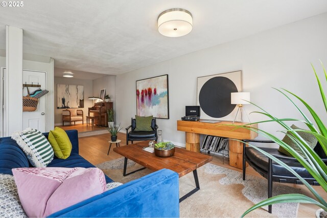 living room with wood finished floors and baseboards