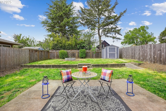 view of patio / terrace featuring a storage unit and an outbuilding