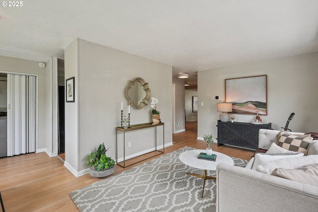 living room with light wood-style floors and baseboards