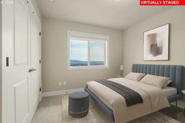 bedroom with baseboards and carpet floors