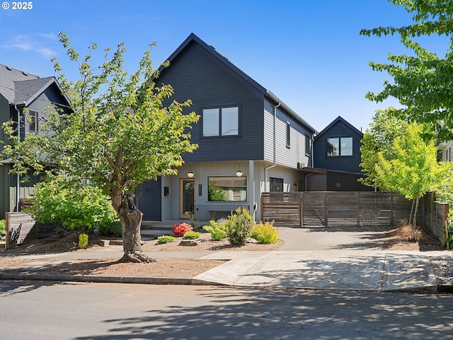 view of front of house featuring a fenced front yard and driveway