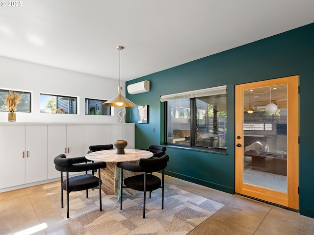 dining space with a wall mounted AC