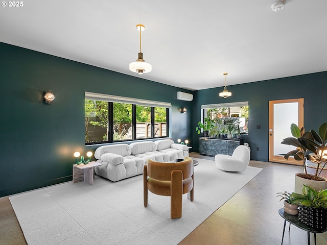 living room featuring concrete flooring and a wall unit AC
