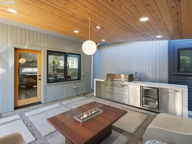 bar area featuring wood ceiling, wine cooler, a sink, inlaid floor details, and recessed lighting
