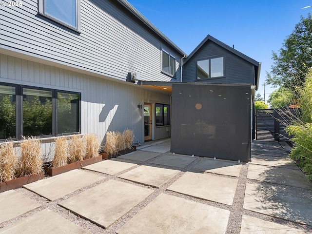 back of house featuring a patio and fence