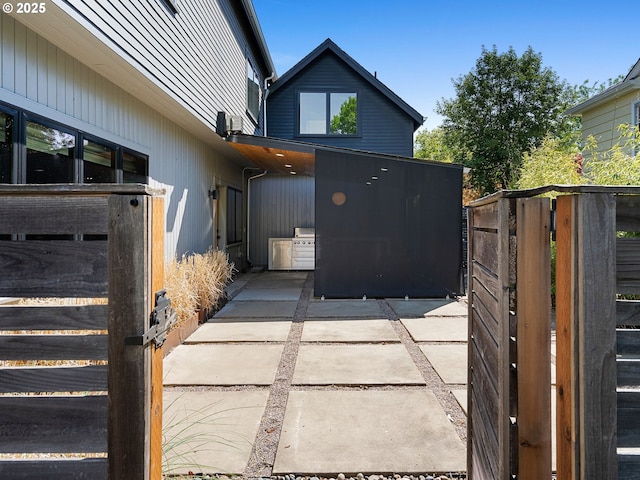 view of property exterior featuring a patio