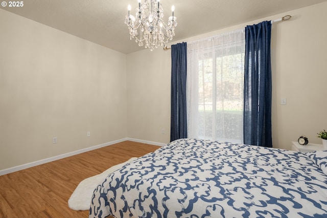 4540 SW 11th St, Gresham, OR 97080 - bedroom with wood finished floors and a chandelier