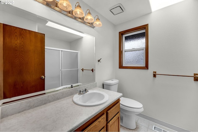 full bathroom featuring a shower with shower door, visible vents, tile patterned floors, toilet, and vanity