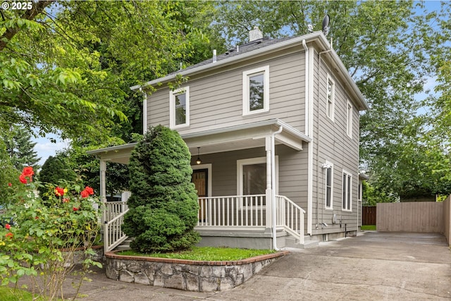 9605 N Hodge Ave, Portland, OR 97203 - traditional style home with a porch, a chimney, and driveway
