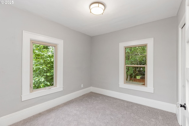 9605 N Hodge Ave, Portland, OR 97203 - unfurnished room featuring plenty of natural light, carpet flooring, and baseboards