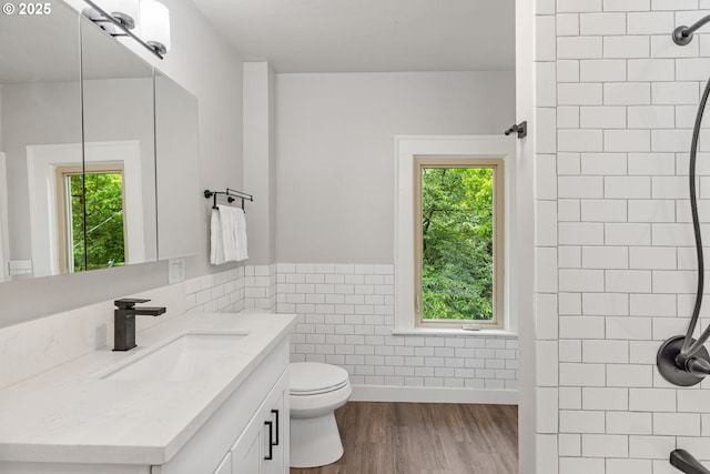 9605 N Hodge Ave, Portland, OR 97203 - full bath featuring a shower, tile walls, healthy amount of natural light, vanity, and wainscoting
