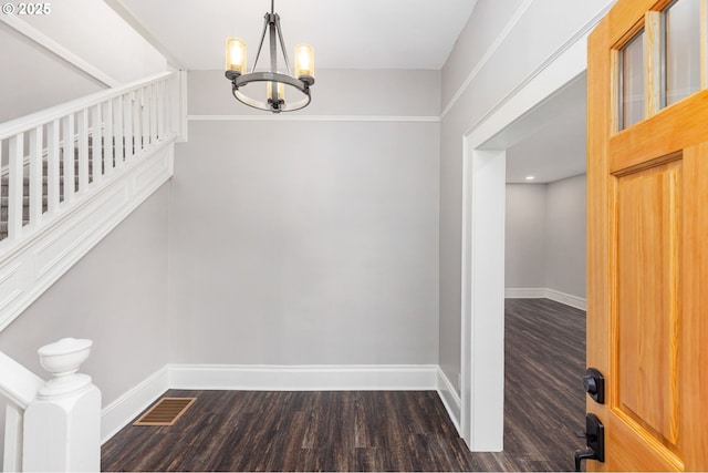 9605 N Hodge Ave, Portland, OR 97203 - corridor with a chandelier, baseboards, and dark wood-style flooring