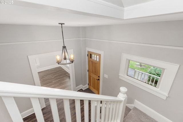 9605 N Hodge Ave, Portland, OR 97203 - stairway with baseboards, a chandelier, and vaulted ceiling