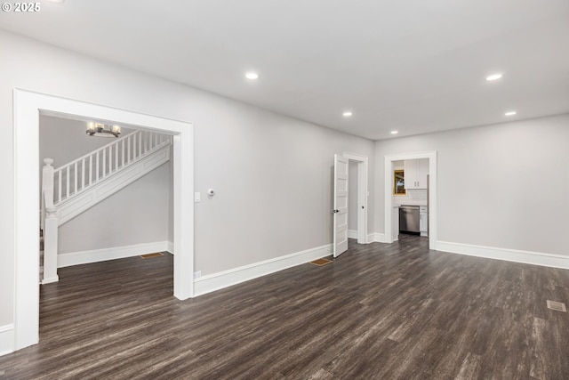9605 N Hodge Ave, Portland, OR 97203 - unfurnished living room featuring dark wood finished floors, baseboards, recessed lighting, stairway, and a chandelier