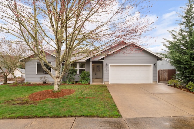 ranch-style home featuring an attached garage, concrete driveway, a front lawn, and fence