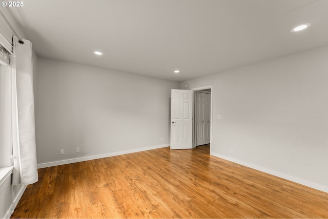 unfurnished bedroom featuring recessed lighting, baseboards, and light wood-style flooring