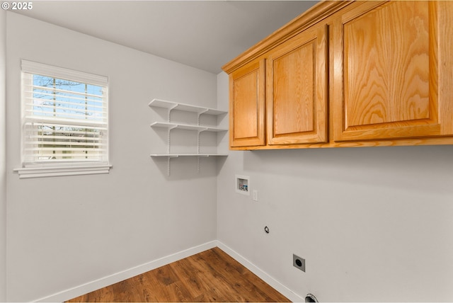 laundry room featuring hookup for a washing machine, dark wood-style floors, baseboards, cabinet space, and electric dryer hookup