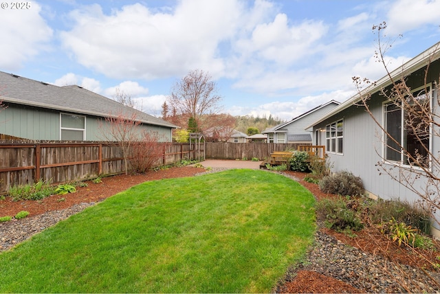 view of yard with a fenced backyard and a patio area