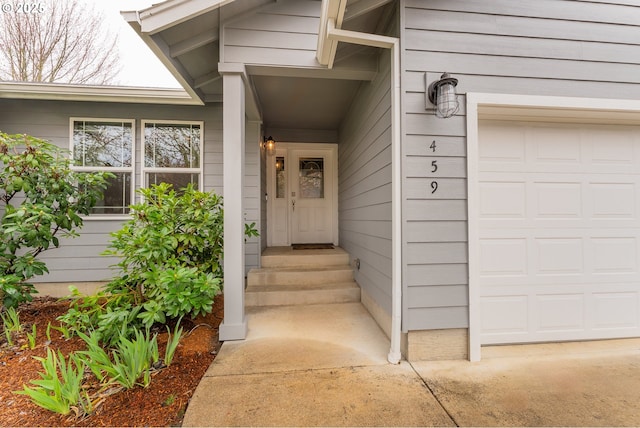 doorway to property featuring a garage