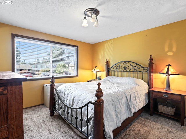 carpeted bedroom with a textured ceiling