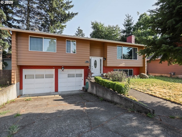 split foyer home featuring a garage