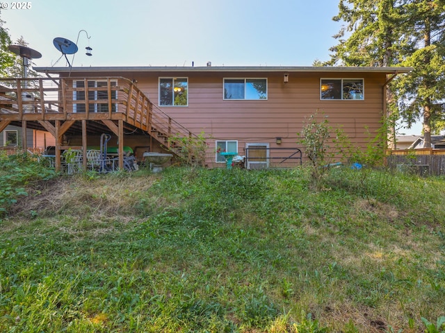 back of house featuring a deck