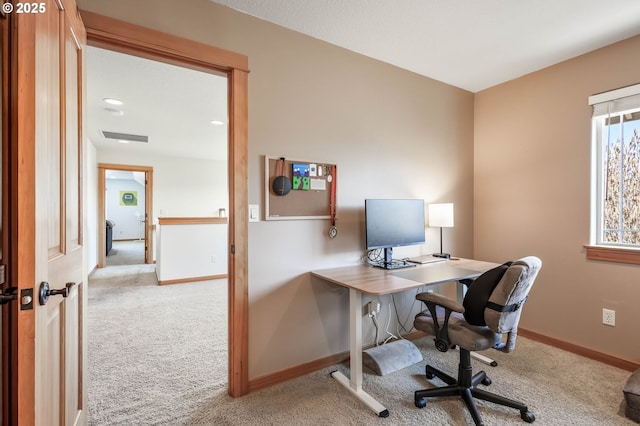 home office with carpet, visible vents, and baseboards