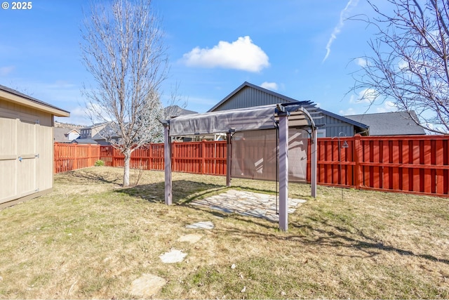 view of yard with a fenced backyard and a pergola