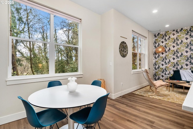 dining area with baseboards, recessed lighting, and wood finished floors