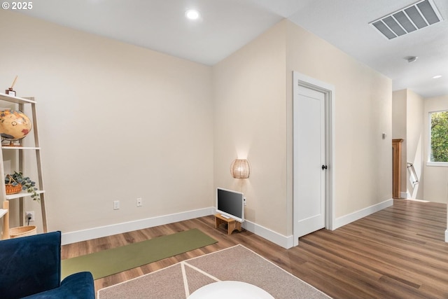 living area with visible vents, recessed lighting, baseboards, and wood finished floors