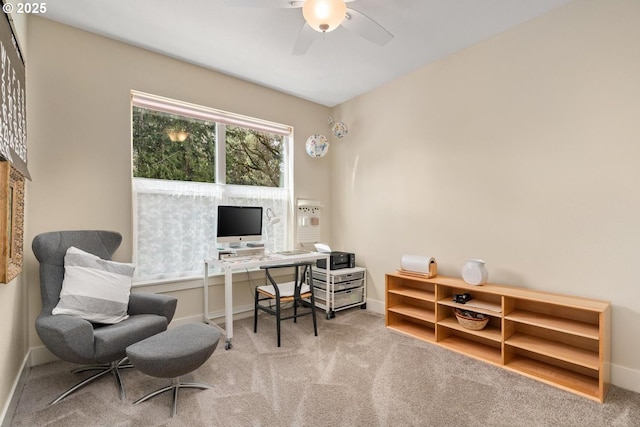office space featuring carpet floors, baseboards, and ceiling fan