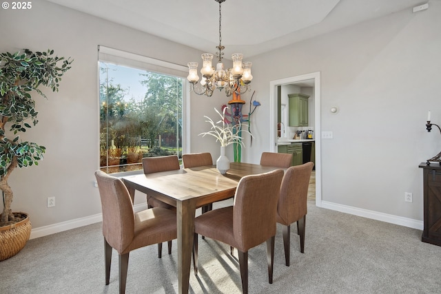 dining space featuring light colored carpet and an inviting chandelier