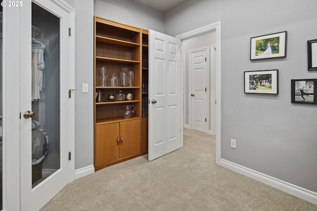 interior space featuring light colored carpet