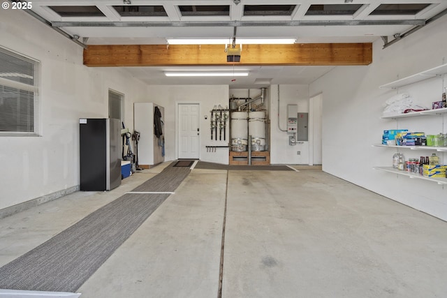 garage with a garage door opener and electric panel