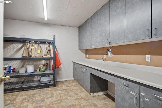 laundry room with a textured ceiling