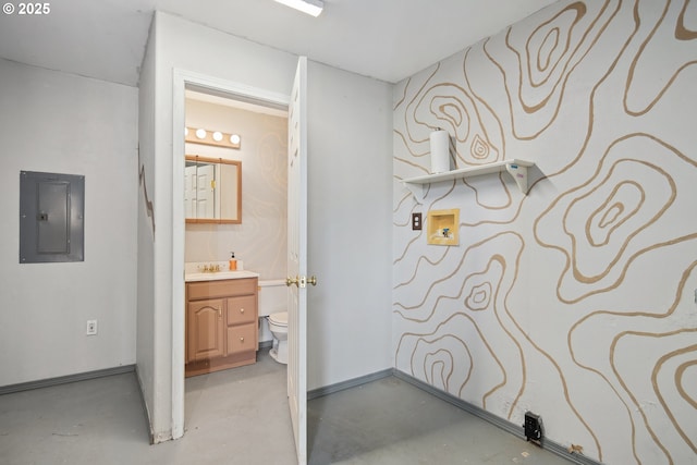 bathroom with vanity, electric panel, concrete floors, and toilet