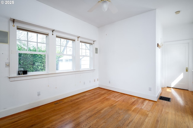 1856 SE Saint Andrews Dr, Portland, OR 97202 - unfurnished room featuring light wood-style floors, ceiling fan, and baseboards
