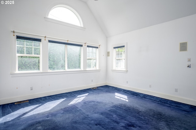 1856 SE Saint Andrews Dr, Portland, OR 97202 - empty room with high vaulted ceiling, dark carpet, and baseboards