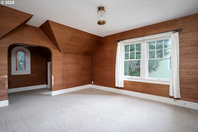 1856 SE Saint Andrews Dr, Portland, OR 97202 - additional living space featuring baseboards, vaulted ceiling, and light carpet