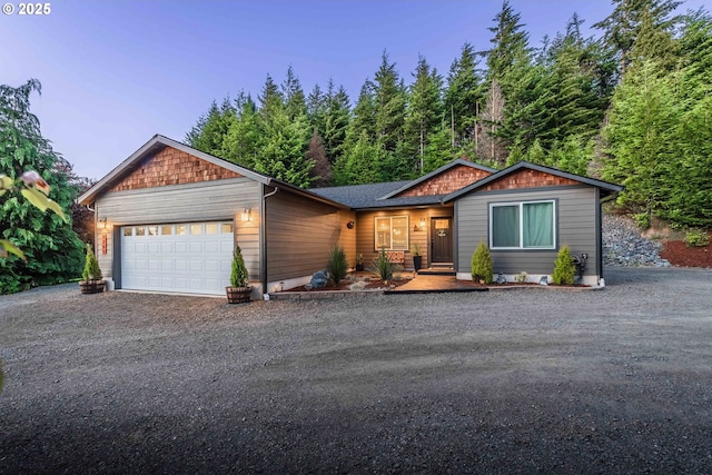 ranch-style home with dirt driveway and a garage